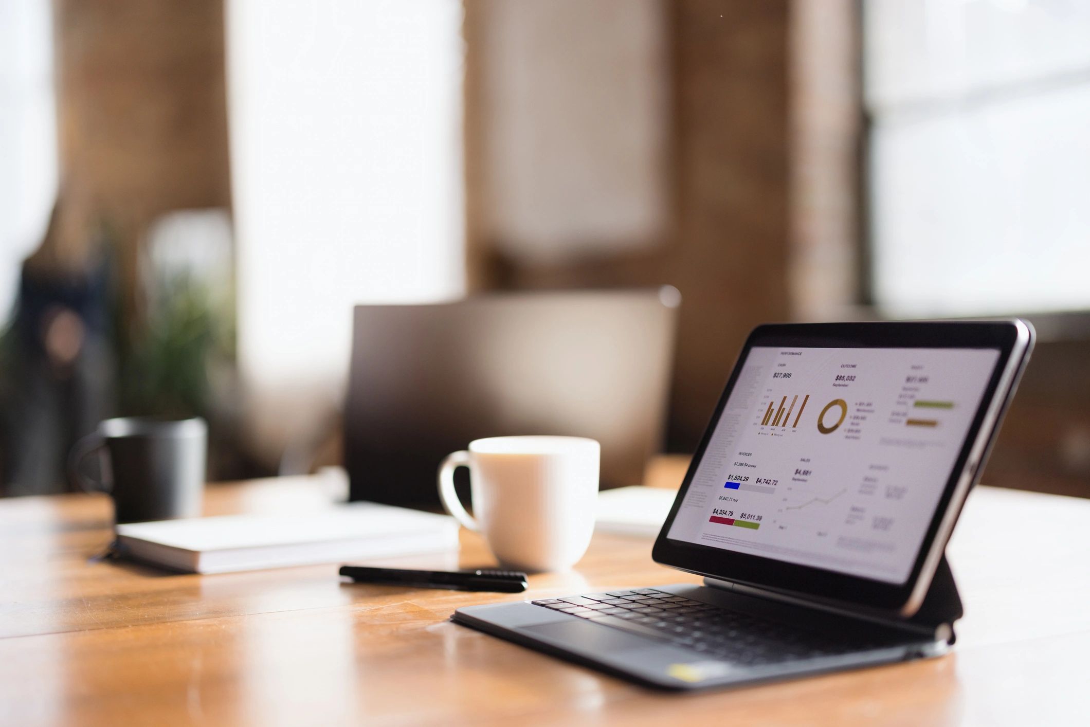 Tablet displaying business chart in office setting