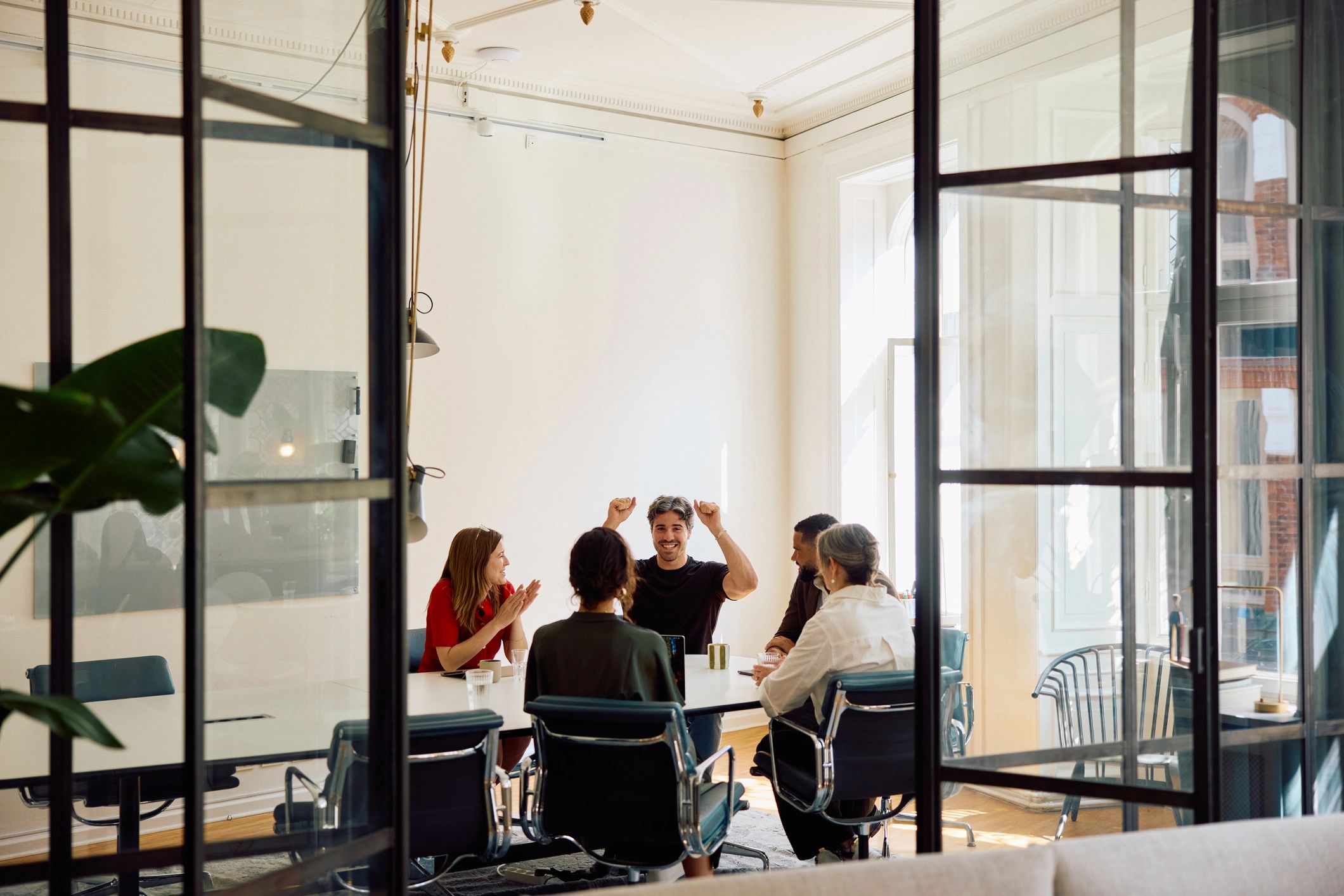Business professionals brainstorming together in a modern office boardroom